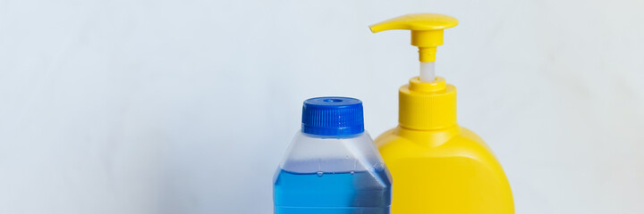 housework, housekeeping and household concept,cleaning stuff on white background.bottle of detergent, rubber gloves with rag ,sponge.domestic cleaning sanitary supplies.Copy space