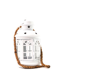 Front view of Ramadan lantern and prayer beads isolated on a white background. Ramadan kareem festive and Islamic holy month greeting