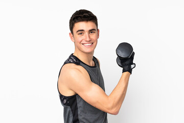 Teenager sport man over isolated white wall making weightlifting