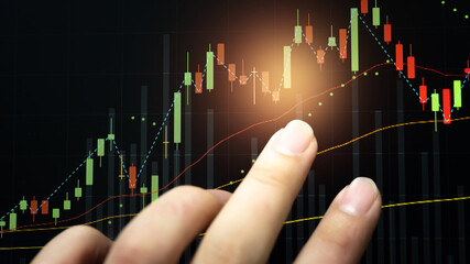 Stock market data on digital LED display. Fundamental and technical analysis with candle stick graph chart of stock market trading to represent about Bullish and Bearish point.