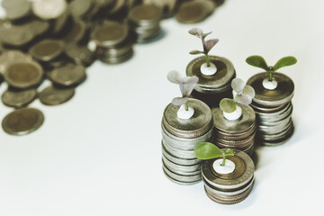 Saving money as a concept. Vintage retro stack of gold coins on the wooden background to represent It's time to do investing for retirement planning.
