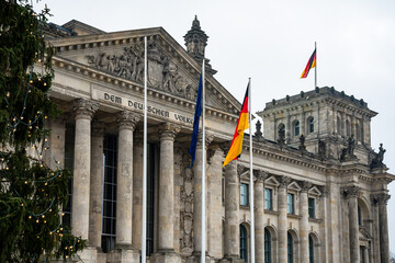 View of the Reichstag building with a Christmas tree in Berlin, Germany. It has been the seat of...