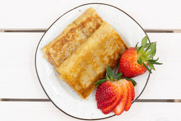 Russian pancakes with strawberry filling. Top view.