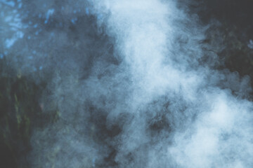 Holidays outdoors. Strong smoke from the grill as background.