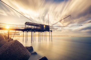 Trabucco (trabocco) at sunset. Pescara, Abruzzo, Italy. The trabucco is an old fishing machine...