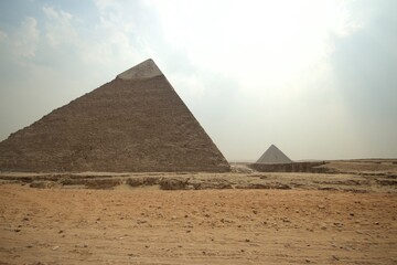 Fototapeta na wymiar Giza Necropolis Pyramids in the sandy desert.
