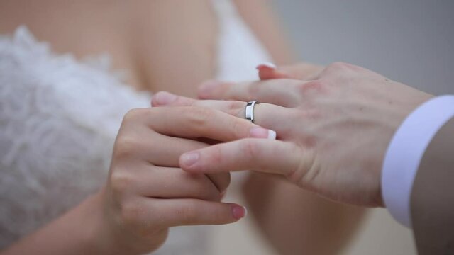 couple exchanging wedding rings on their wedding day
