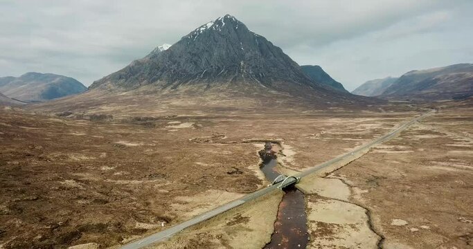 4k panoramic aerial footage of Rannoch Moor, Glencoe and the A82 road, panning backwards and down.