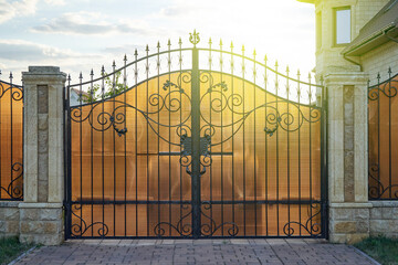 Forged metal gates with ornate lines in a private house.