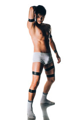 Portrait of an Caucasian male fashion model posing in white underwear