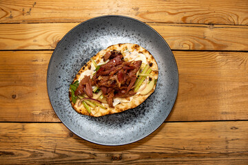 A delicious plate of Shredded Ham with Apple Slaw on a wooden kitchen tableA delicious plate of Shredded Ham with Apple Slaw on a wooden kitchen table