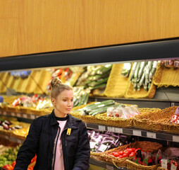 Woman buying fruits and vegetables  at the market