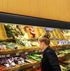 Woman buying fruits and vegetables  at the market
