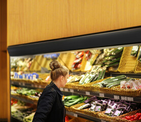 Woman buying fruits and vegetables  at the market