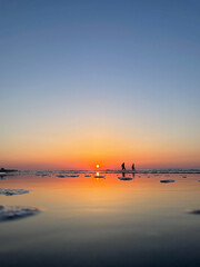 silhouette of people on the beach