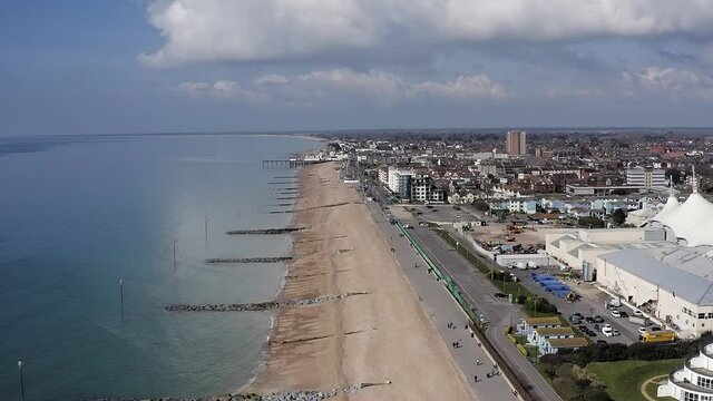 Aerial footage of  the popular seaside resort of Bognor Regis in Southern England from Felpham and the wide beach. on a sunny and clear Spring day.