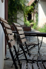 Two empty garden chairs in the yard