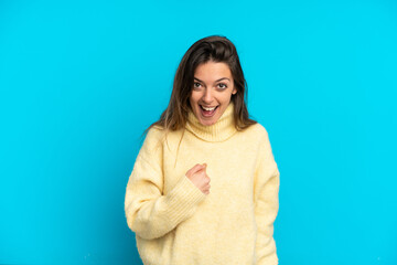 Young caucasian woman isolated on blue background with surprise facial expression