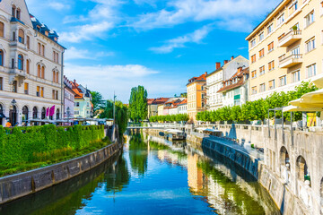 Fototapeta na wymiar LJUBLJANA, SLOVENIA, 5th AUGUST 2019: The river flowing in the historic center