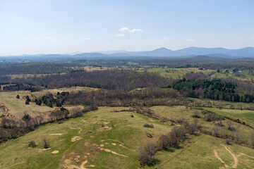 Fototapeta na wymiar Aerial view of farmland and the Blue Ridge Mountains near Marshall, Fauquier County, Virginia. 