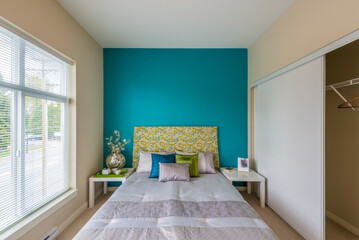 Modern brown bedroom interior in a luxury house with reclaimed wood bedside tables and a beautiful watercolor on the wall