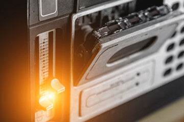 Old tape recorder with audio cassette.