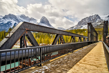 Views along a repurposed railway bridge over Bow River in Canmore Alberta