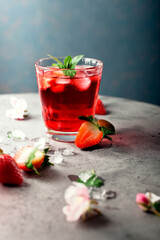Fresh strawberry and mint drink/cocktail on grey background