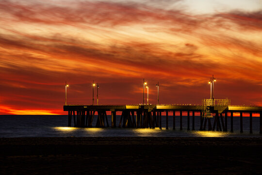 red skies over the pier