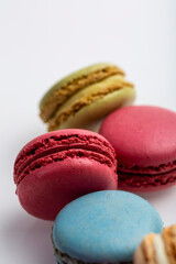 Macro Photography Macaroons pattern on white background. Colorful french desserts. Top view