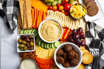 Bright and colorful charcuterie board platter and vegan Appetizer table