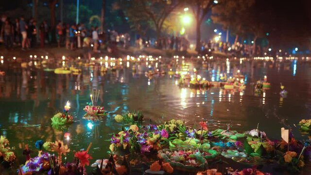 Loi Krathong. Bangkok, Thailand. Floating baskets - lanterns. Pond shore