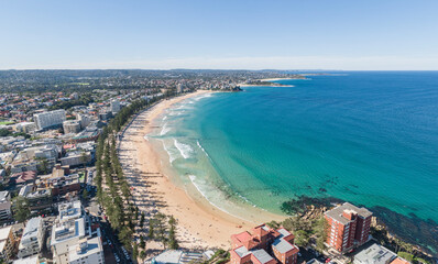 Panoramic high angle aerial drone shot of famous Manly Beach, a beach-side suburb of northern...