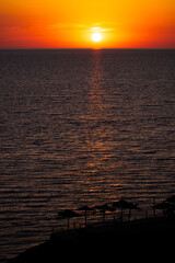 Sun setting with castle in the foreground