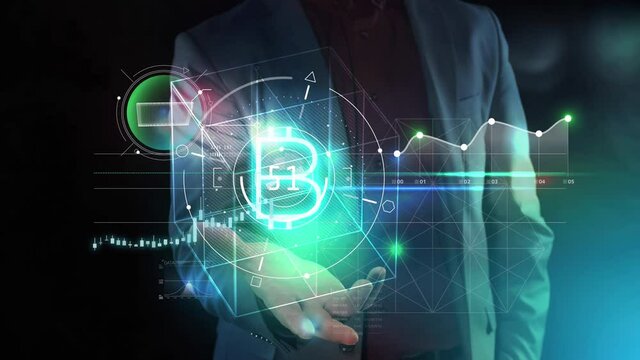 Bitcoin virtual infographics on a man's palm.