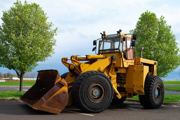 Obraz na płótnie Canvas large tractor loader bulldozer yellow wheel heavy