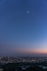 Naklejka premium Sunset over downtown Los Angeles from Griffith Observatory
