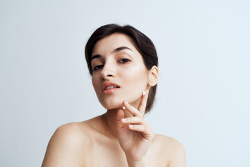 Beautiful brunette clean skin care face dermatology cream