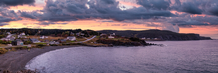 Panoramic view of a small town on the Atlantic Ocean Coast. Colorful Sunset Sky Art Render. Taken in Little Wild Cove, North Twillingate Island, Newfoundland and Labrador, Canada. © edb3_16