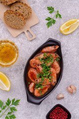 Unpeeled cooked prawns