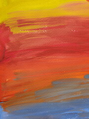 Paintbrush strokes surface on rough watercolor paper. Gradient stripes of vibrant color paints looking like rainbow or sunset sky. Close-up shot of colorful painted texture