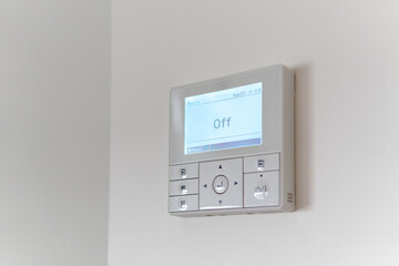 Air conditioning controller on the wall that shows off