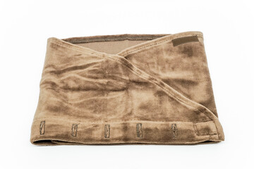 Brown towel headband for eyelash extension treatment on white background.