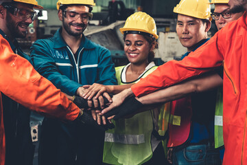 Skillful worker stand together showing teamwork in the factory . Industrial people and...