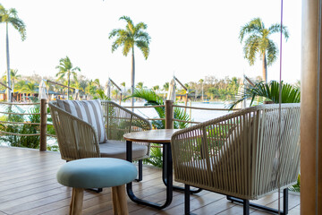 Cafe exterior design on the beach cafe on terrace near the lagoon. Restaurant on coastline.