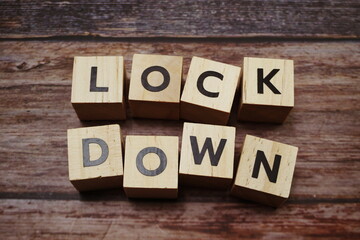 Lockdown alphabet letters on wooden background