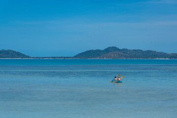 Tourist is kayaking at the Koh Samui, during summer time in Thailand.