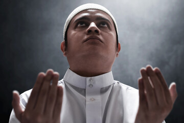 Religious asian muslim man praying