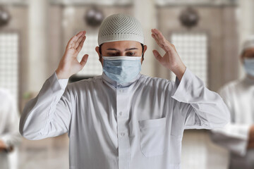 Religious asian muslim man praying