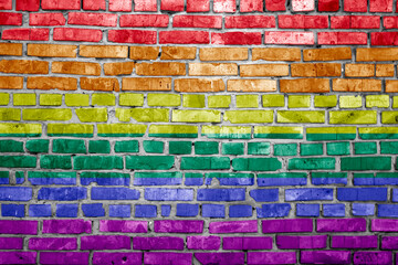 lgbt flag painted on brick wall
